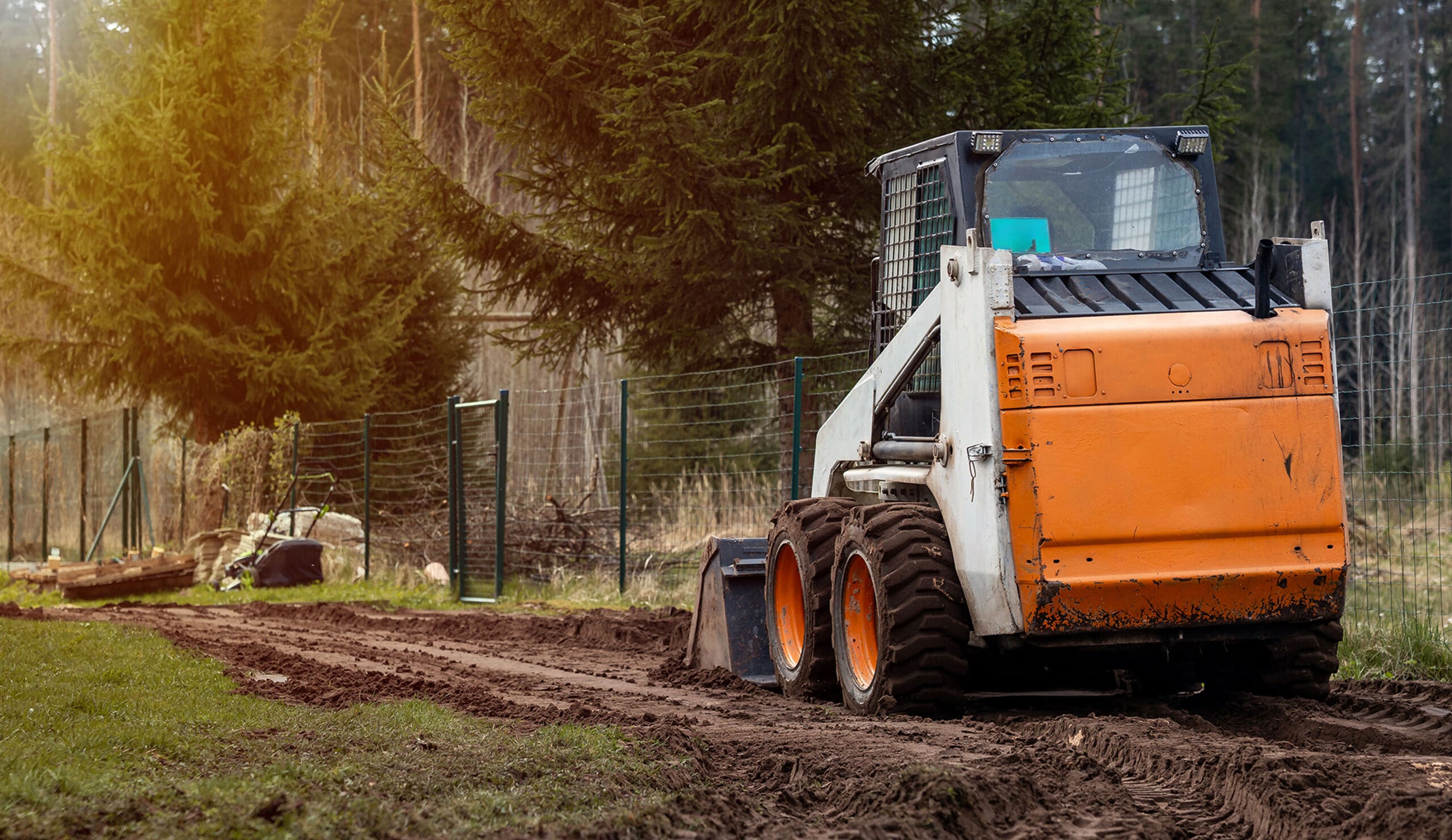 Skid Steer Loader leveling a construction site